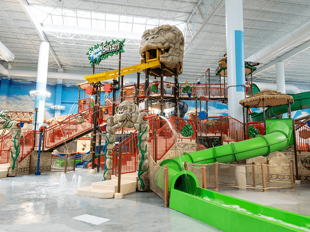 Indoor water park with green slide